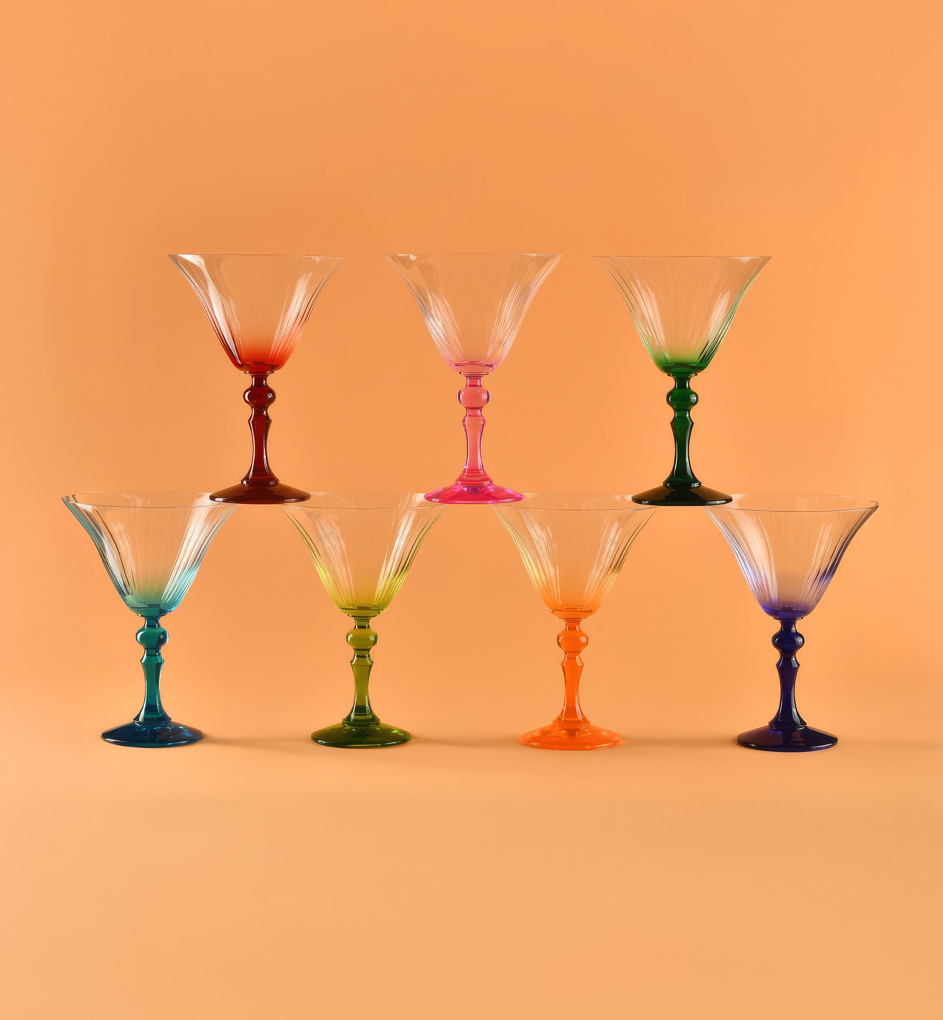 Shaded martini glasses with a dark green stem