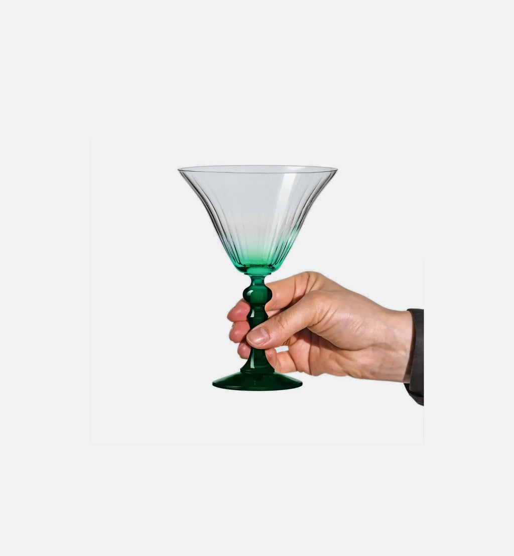 Shaded martini glasses with a dark green stem